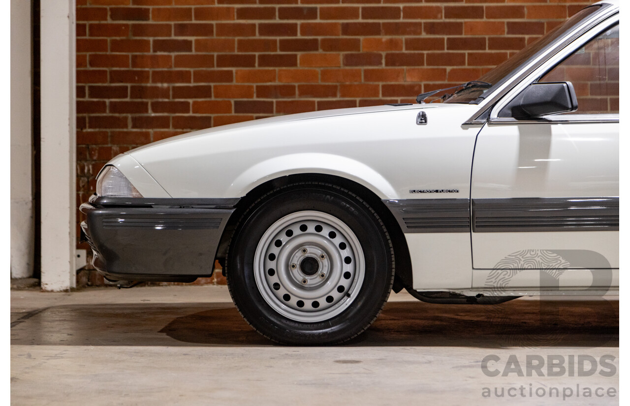 6/1987 Holden Commodore VL Turbo SL BT1 4d Sedan White Turbo 3.0L - Ex-Police - Modified