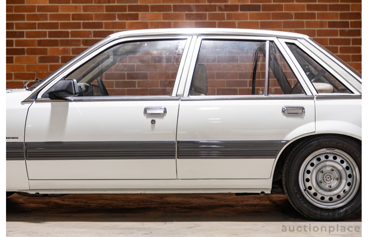 6/1987 Holden Commodore VL Turbo SL BT1 4d Sedan White Turbo 3.0L - Ex-Police - Modified