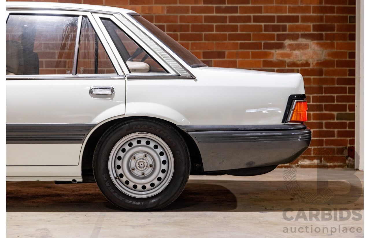 6/1987 Holden Commodore VL Turbo SL BT1 4d Sedan White Turbo 3.0L - Ex-Police - Modified