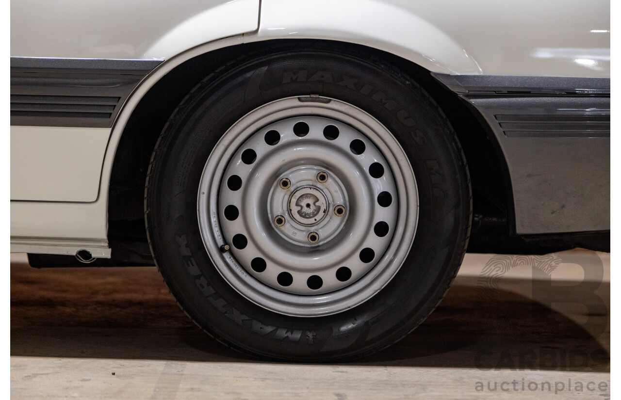 6/1987 Holden Commodore VL Turbo SL BT1 4d Sedan White Turbo 3.0L - Ex-Police - Modified