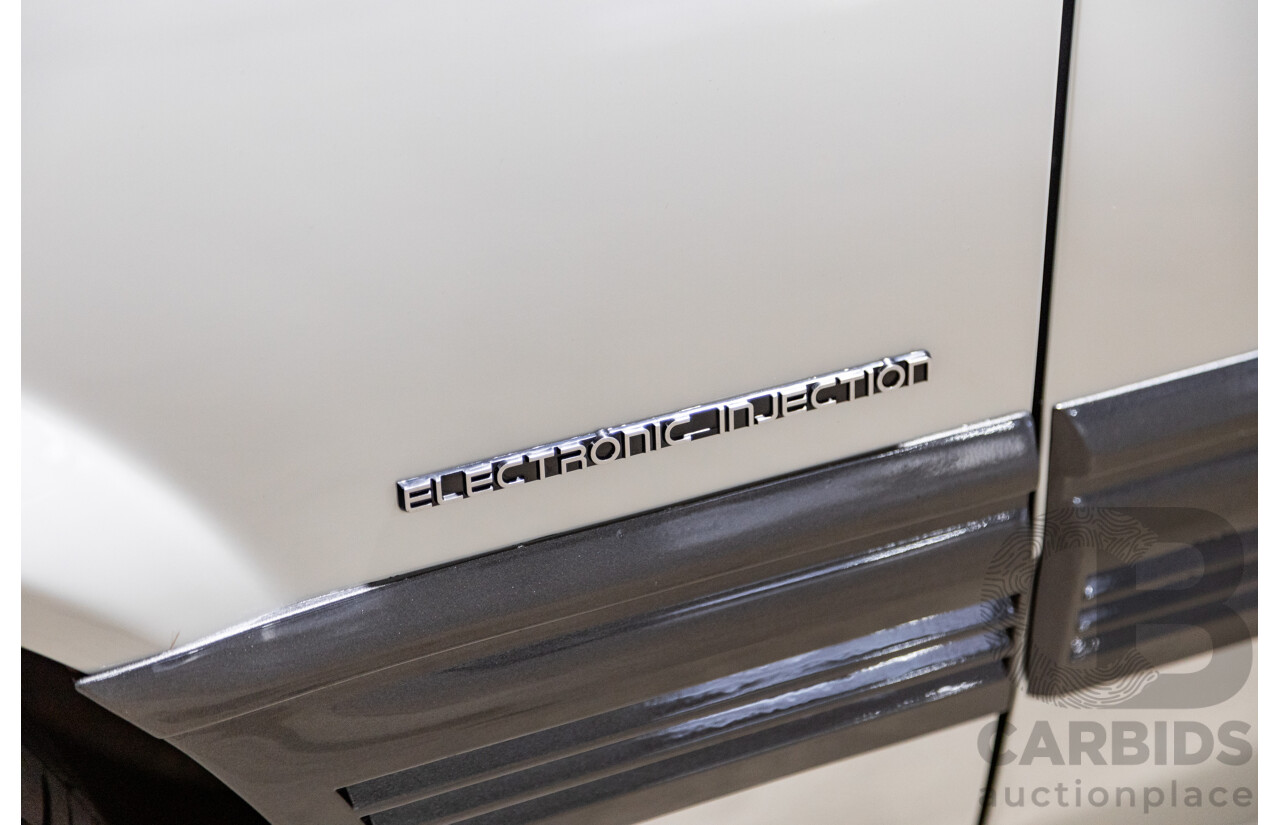 6/1987 Holden Commodore VL Turbo SL BT1 4d Sedan White Turbo 3.0L - Ex-Police - Modified