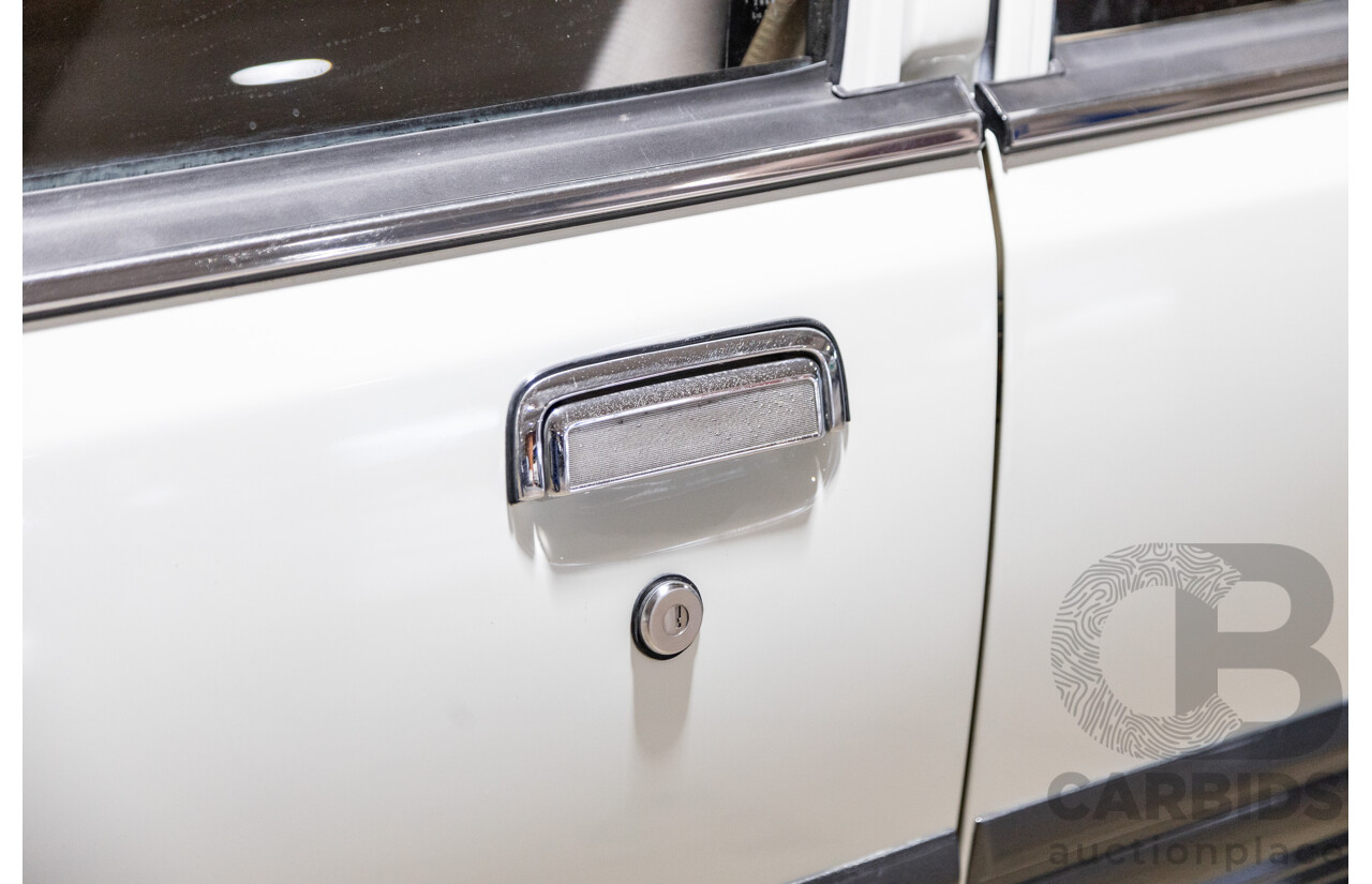 6/1987 Holden Commodore VL Turbo SL BT1 4d Sedan White Turbo 3.0L - Ex-Police - Modified