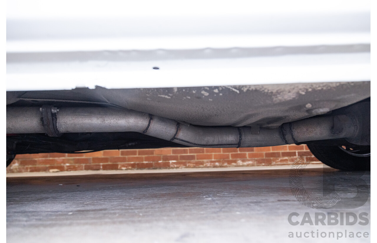 6/1987 Holden Commodore VL Turbo SL BT1 4d Sedan White Turbo 3.0L - Ex-Police - Modified