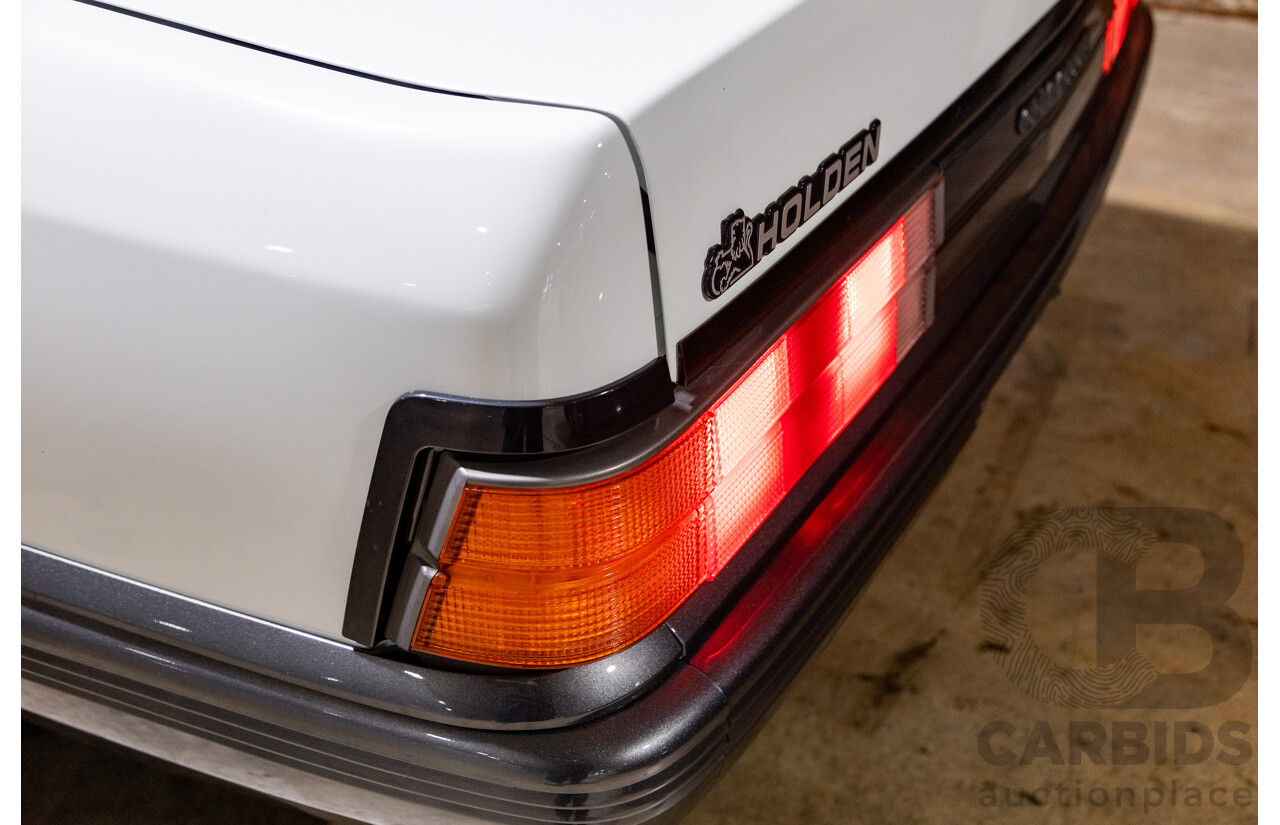 6/1987 Holden Commodore VL Turbo SL BT1 4d Sedan White Turbo 3.0L - Ex-Police - Modified