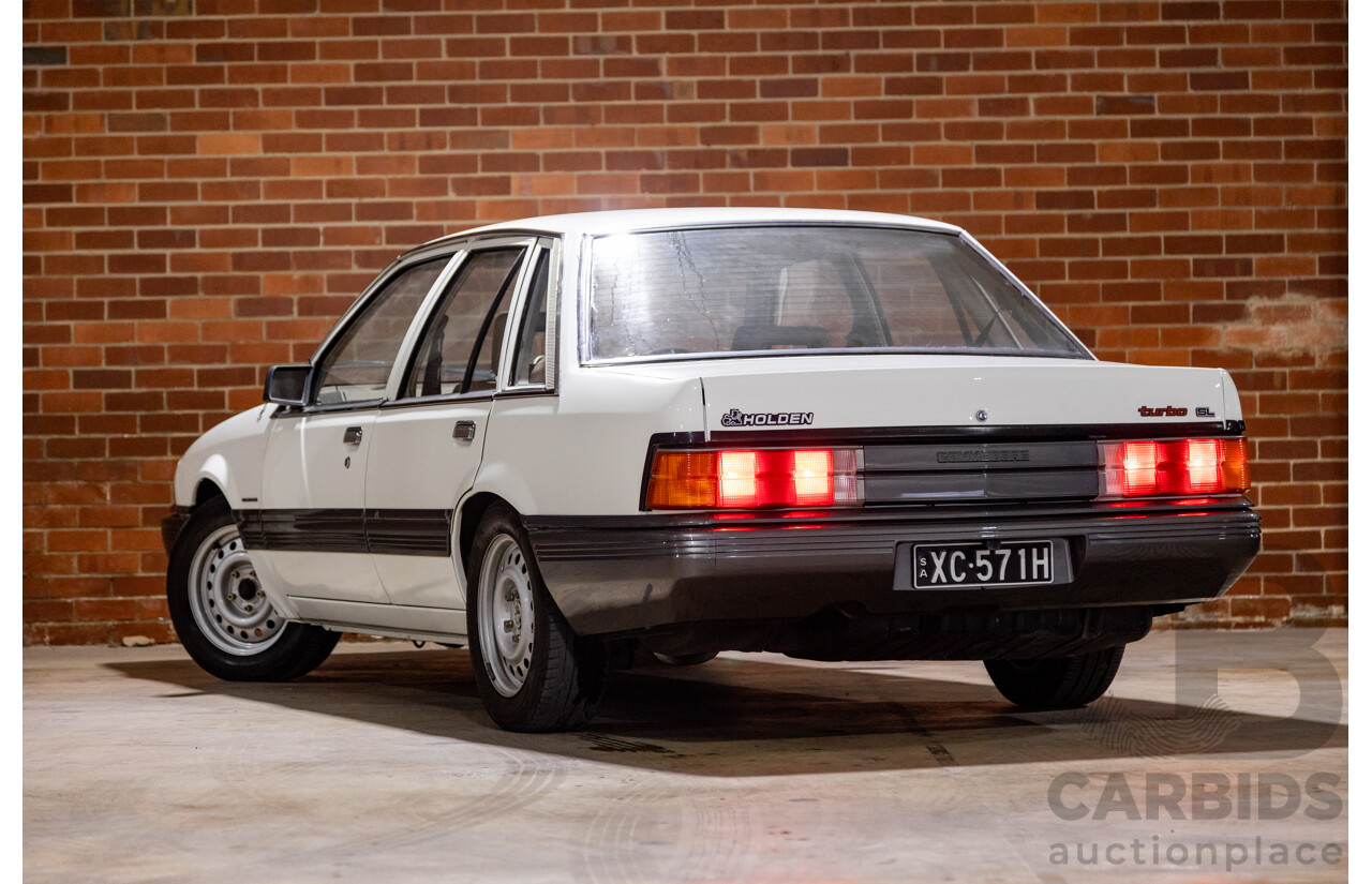 6/1987 Holden Commodore VL Turbo SL BT1 4d Sedan White Turbo 3.0L - Ex-Police - Modified