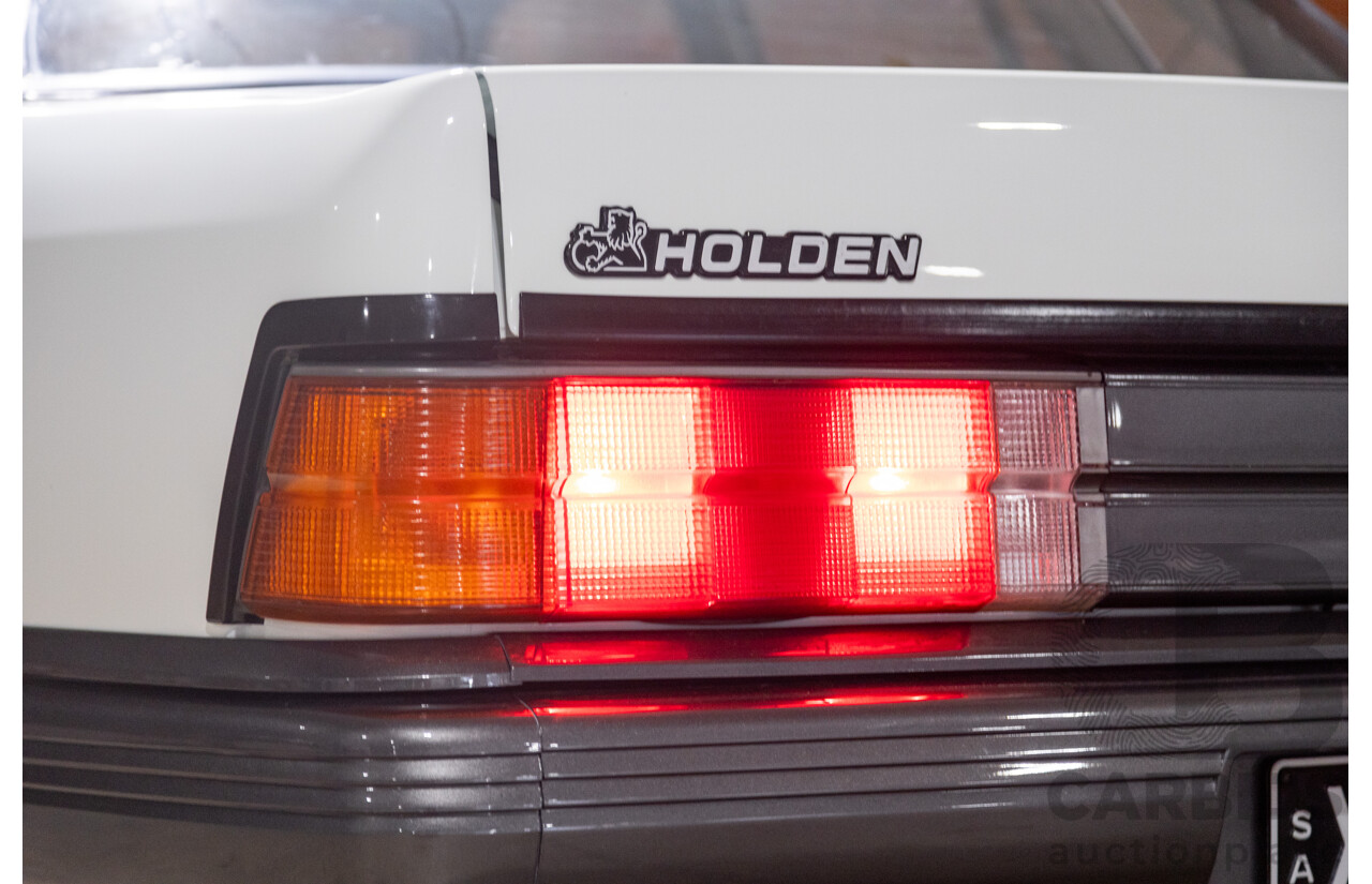 6/1987 Holden Commodore VL Turbo SL BT1 4d Sedan White Turbo 3.0L - Ex-Police - Modified