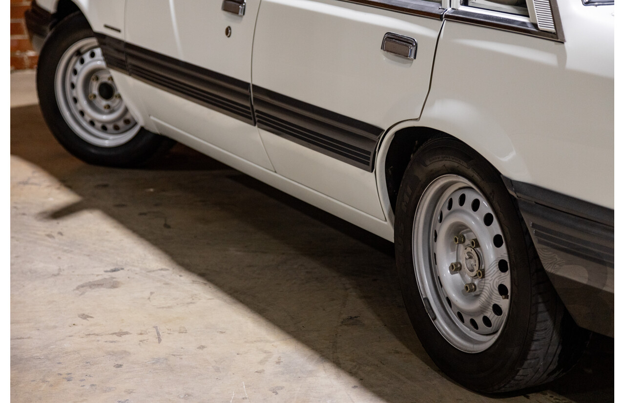 6/1987 Holden Commodore VL Turbo SL BT1 4d Sedan White Turbo 3.0L - Ex-Police - Modified