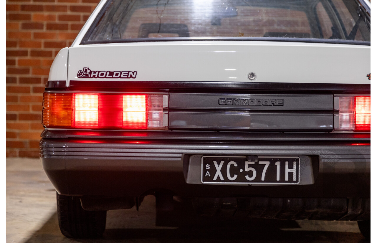 6/1987 Holden Commodore VL Turbo SL BT1 4d Sedan White Turbo 3.0L - Ex-Police - Modified