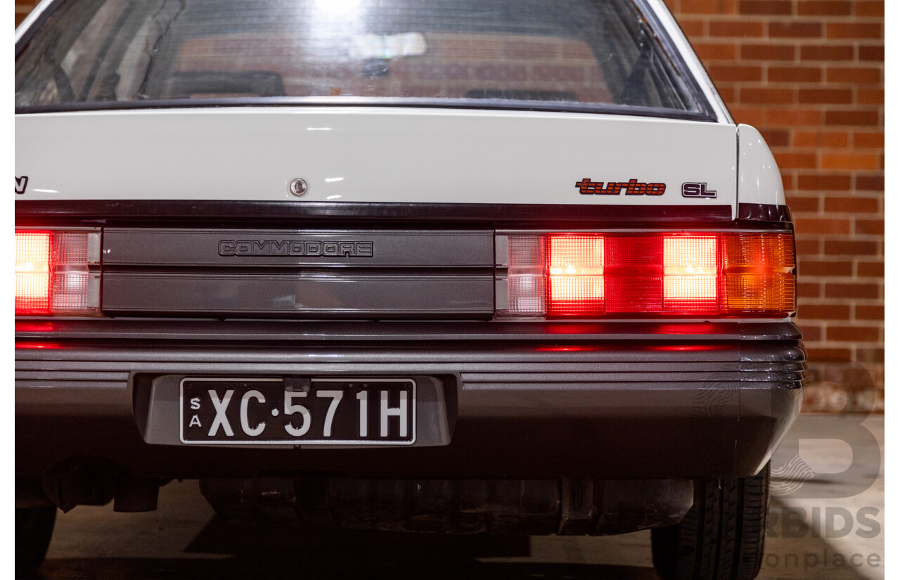 6/1987 Holden Commodore VL Turbo SL BT1 4d Sedan White Turbo 3.0L - Ex-Police - Modified