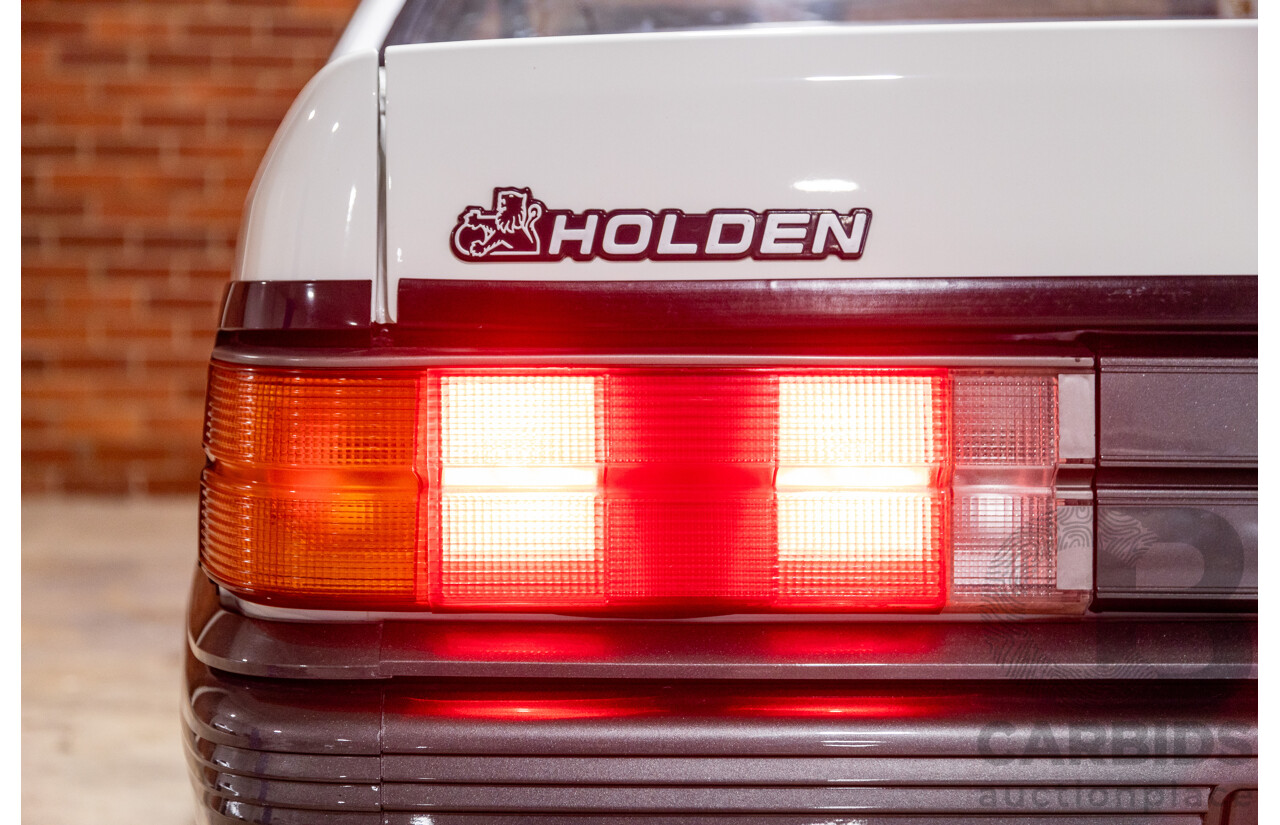 6/1987 Holden Commodore VL Turbo SL BT1 4d Sedan White Turbo 3.0L - Ex-Police - Modified