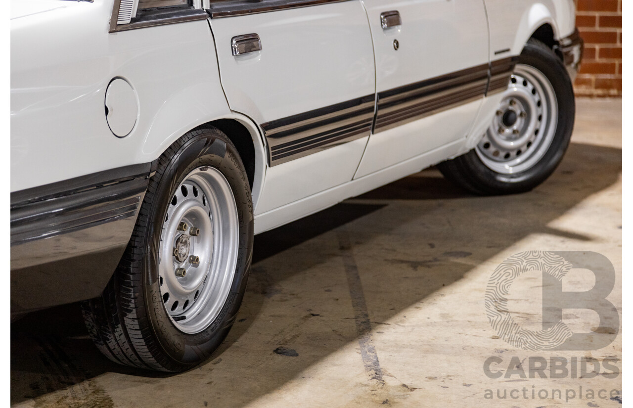 6/1987 Holden Commodore VL Turbo SL BT1 4d Sedan White Turbo 3.0L - Ex-Police - Modified