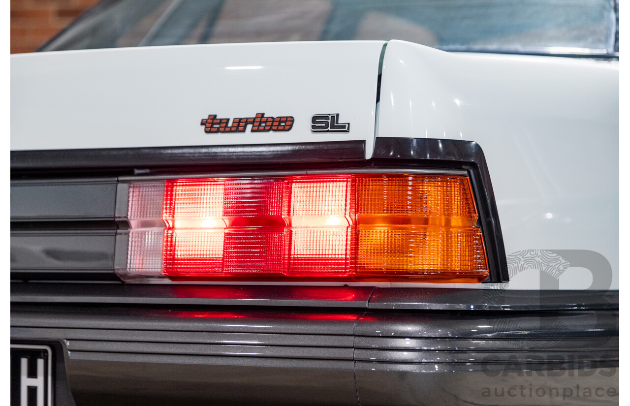 6/1987 Holden Commodore VL Turbo SL BT1 4d Sedan White Turbo 3.0L - Ex-Police - Modified