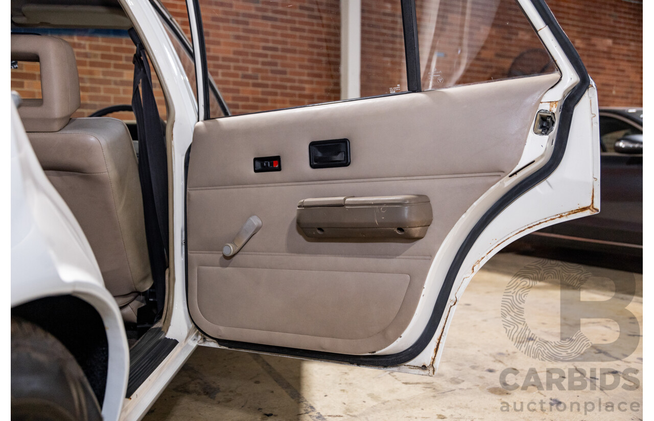 6/1987 Holden Commodore VL Turbo SL BT1 4d Sedan White Turbo 3.0L - Ex-Police - Modified