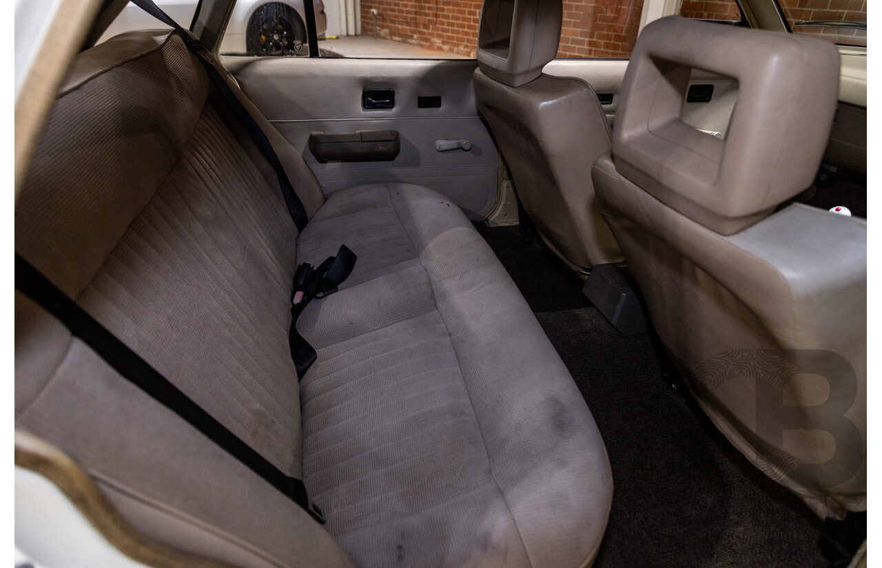 6/1987 Holden Commodore VL Turbo SL BT1 4d Sedan White Turbo 3.0L - Ex-Police - Modified