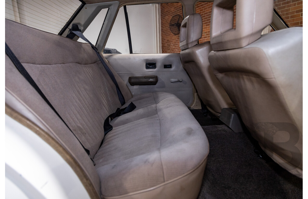 6/1987 Holden Commodore VL Turbo SL BT1 4d Sedan White Turbo 3.0L - Ex-Police - Modified