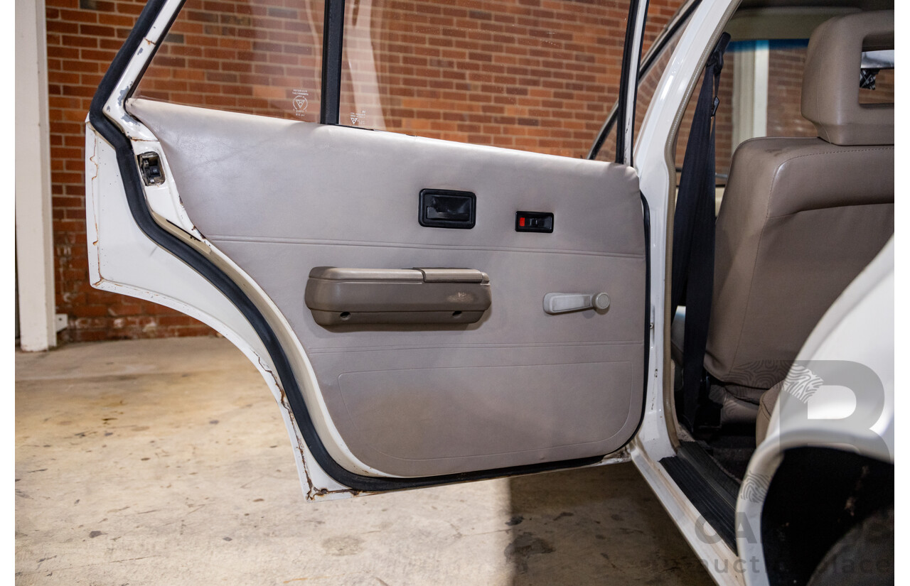 6/1987 Holden Commodore VL Turbo SL BT1 4d Sedan White Turbo 3.0L - Ex-Police - Modified