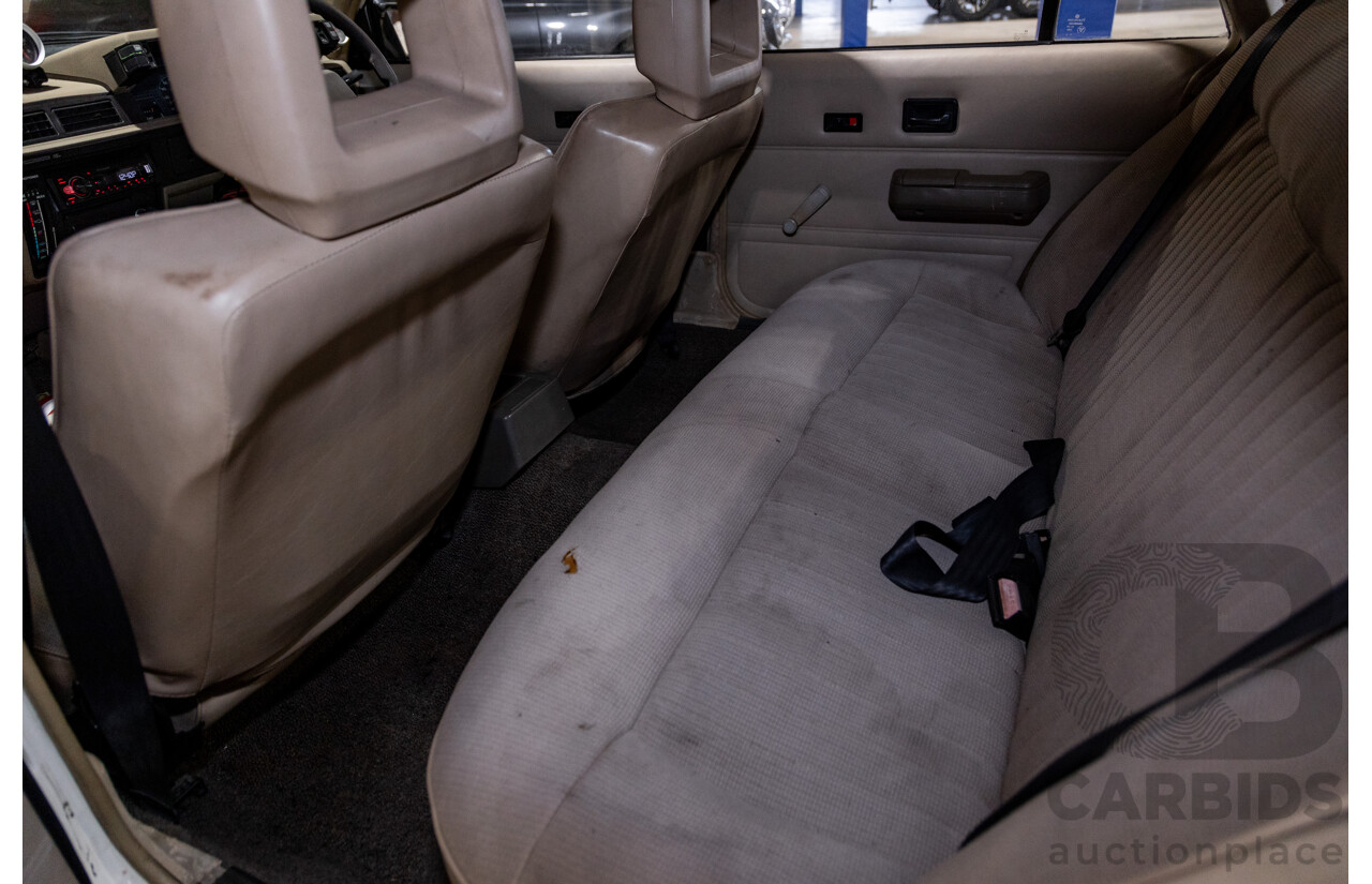 6/1987 Holden Commodore VL Turbo SL BT1 4d Sedan White Turbo 3.0L - Ex-Police - Modified