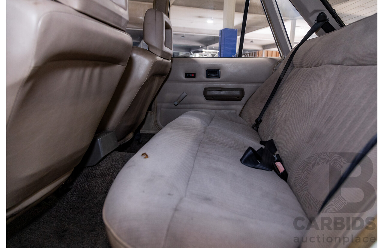 6/1987 Holden Commodore VL Turbo SL BT1 4d Sedan White Turbo 3.0L - Ex-Police - Modified