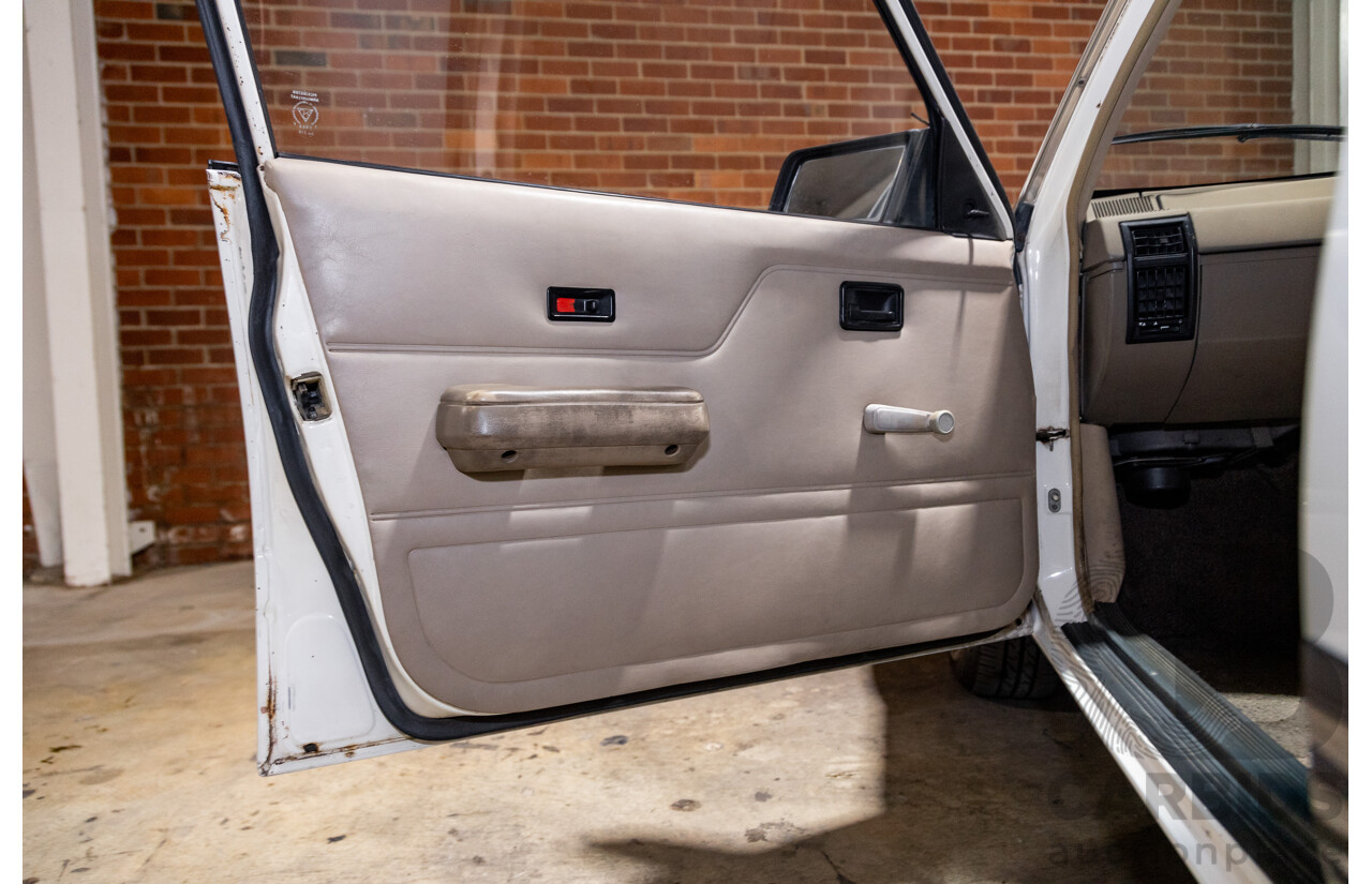 6/1987 Holden Commodore VL Turbo SL BT1 4d Sedan White Turbo 3.0L - Ex-Police - Modified