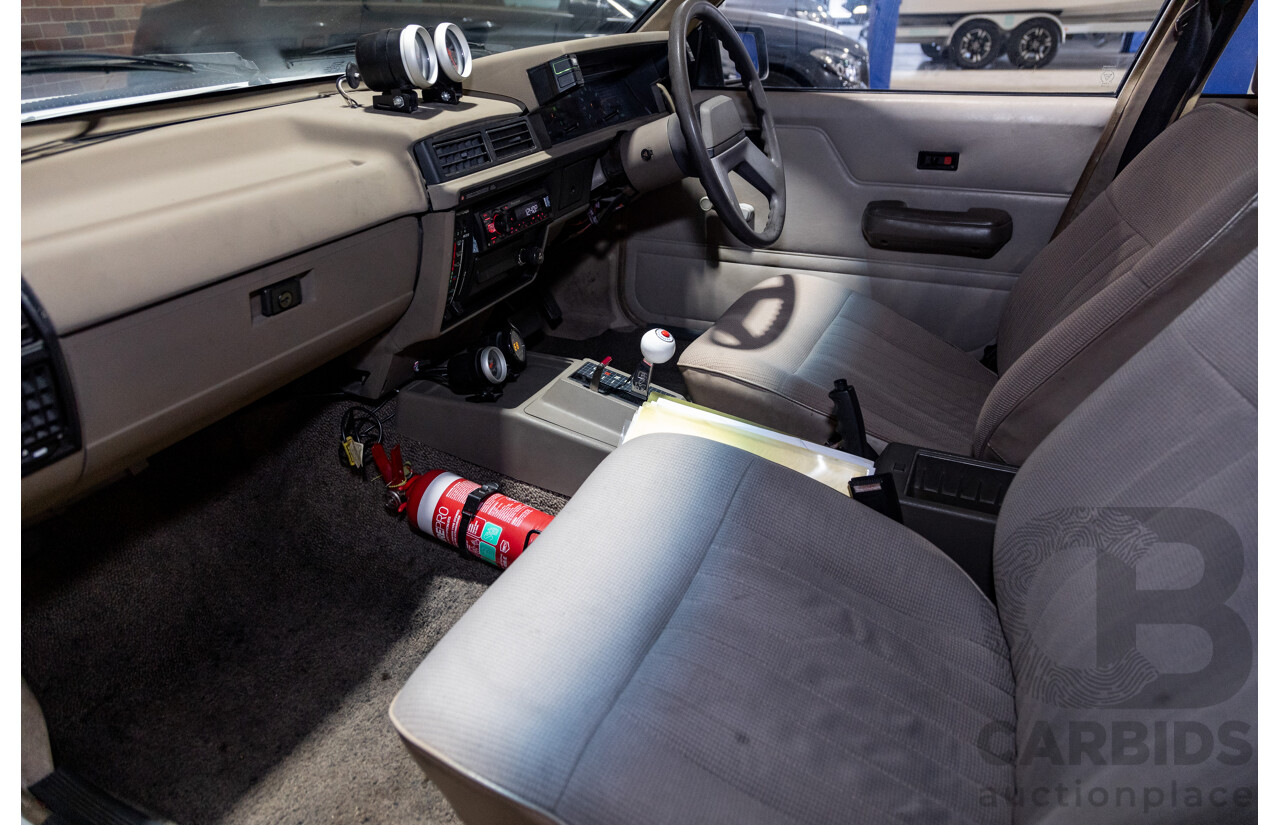 6/1987 Holden Commodore VL Turbo SL BT1 4d Sedan White Turbo 3.0L - Ex-Police - Modified