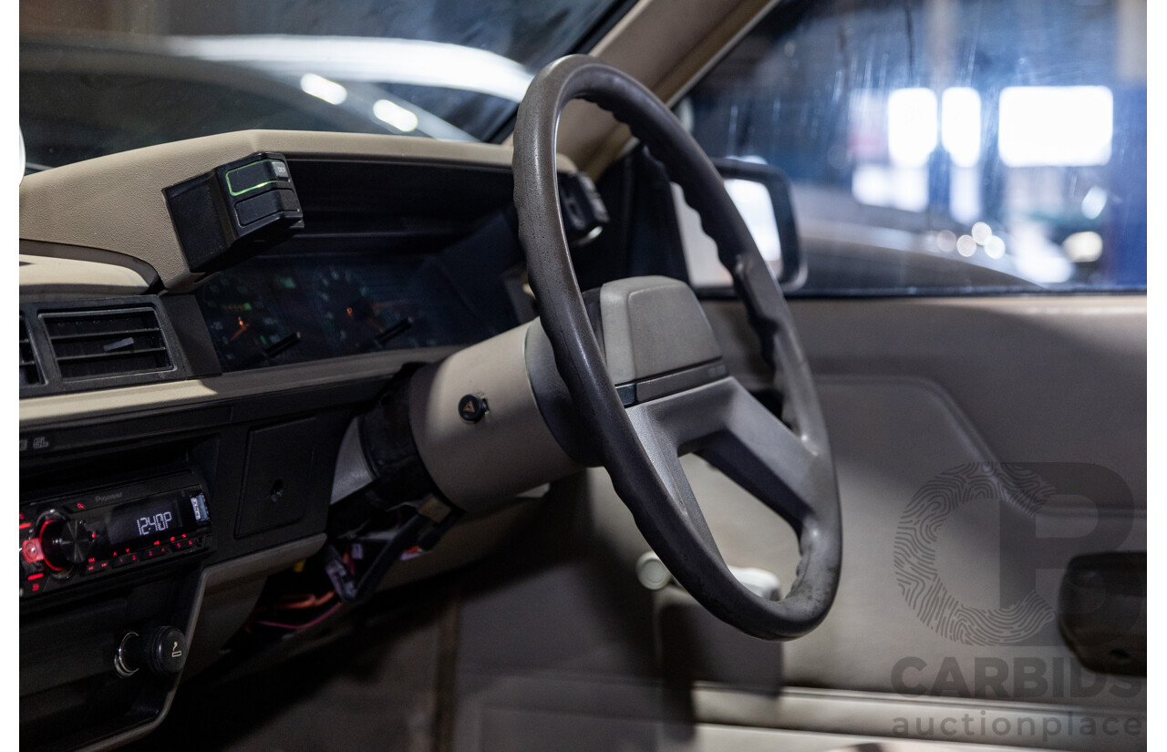 6/1987 Holden Commodore VL Turbo SL BT1 4d Sedan White Turbo 3.0L - Ex-Police - Modified