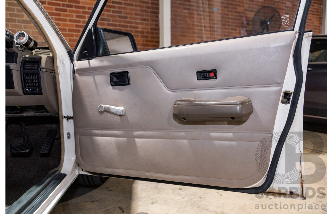 6/1987 Holden Commodore VL Turbo SL BT1 4d Sedan White Turbo 3.0L - Ex-Police - Modified