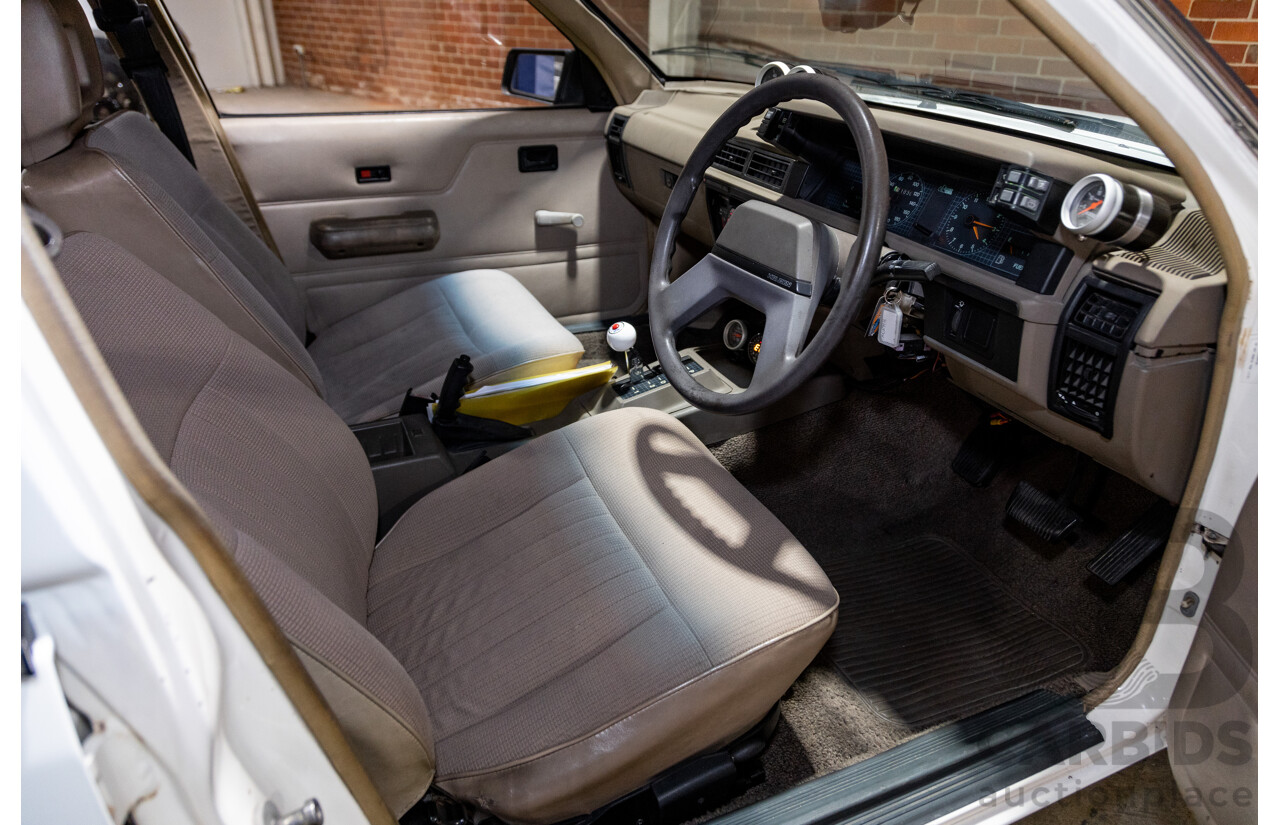 6/1987 Holden Commodore VL Turbo SL BT1 4d Sedan White Turbo 3.0L - Ex-Police - Modified