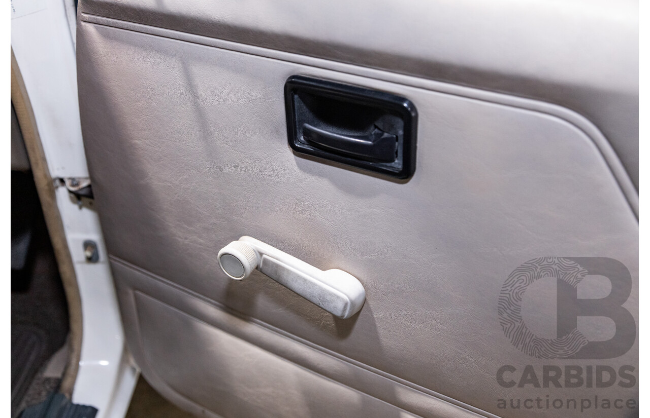 6/1987 Holden Commodore VL Turbo SL BT1 4d Sedan White Turbo 3.0L - Ex-Police - Modified