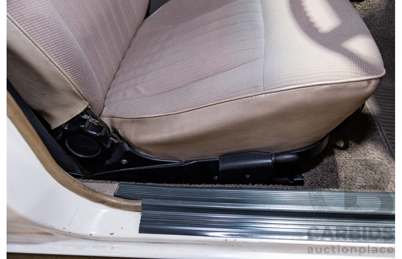 6/1987 Holden Commodore VL Turbo SL BT1 4d Sedan White Turbo 3.0L - Ex-Police - Modified