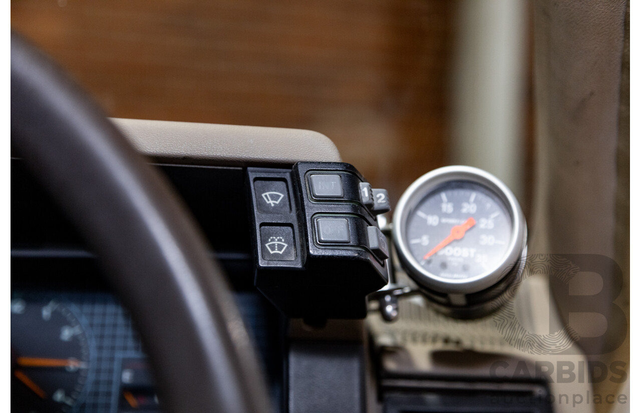 6/1987 Holden Commodore VL Turbo SL BT1 4d Sedan White Turbo 3.0L - Ex-Police - Modified