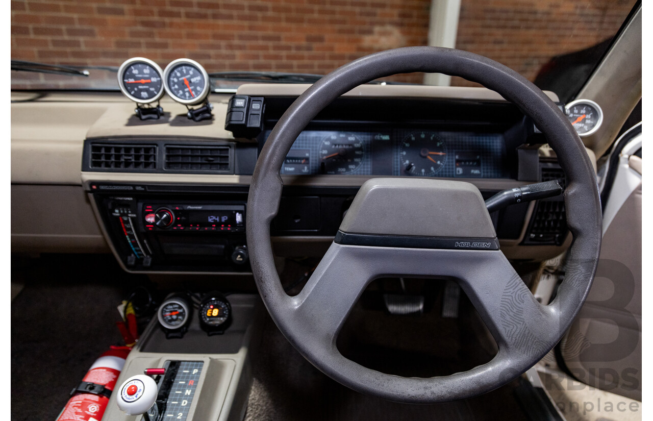 6/1987 Holden Commodore VL Turbo SL BT1 4d Sedan White Turbo 3.0L - Ex-Police - Modified