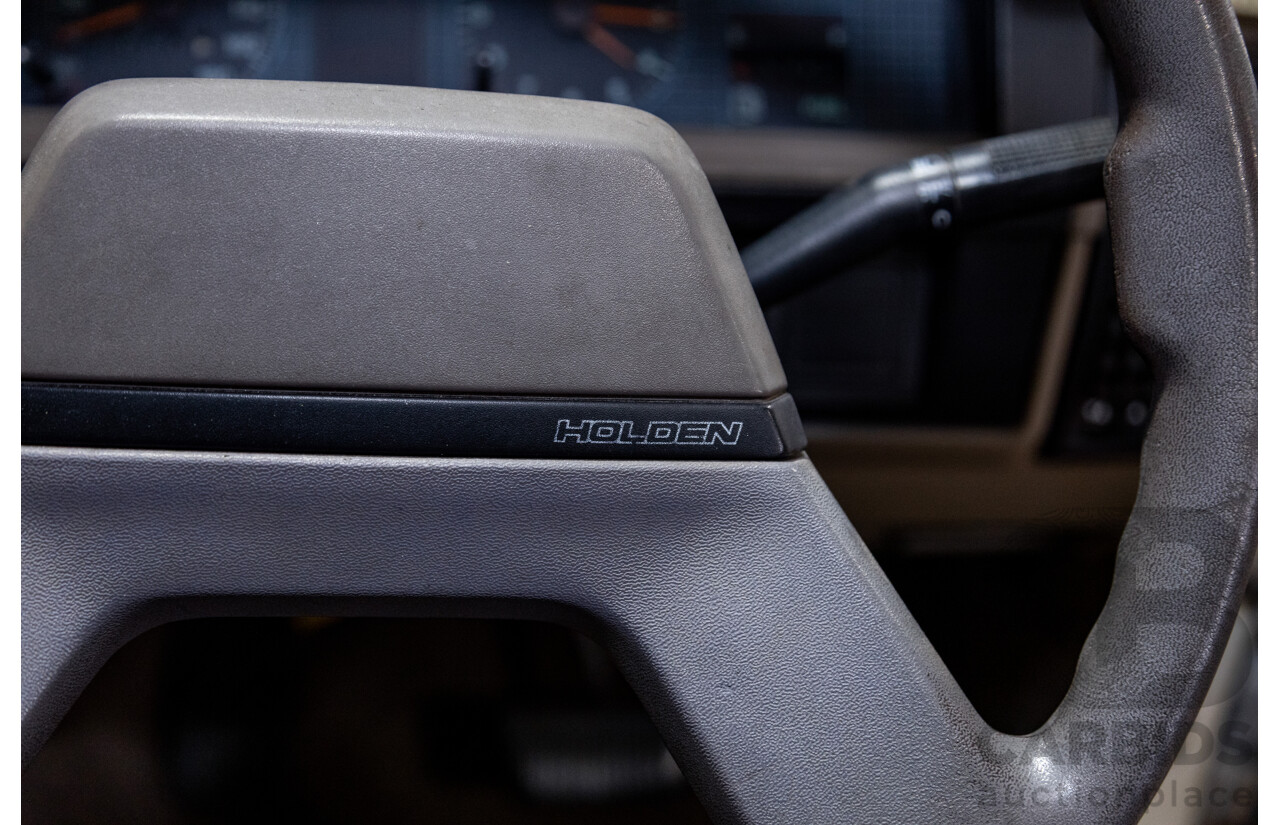 6/1987 Holden Commodore VL Turbo SL BT1 4d Sedan White Turbo 3.0L - Ex-Police - Modified