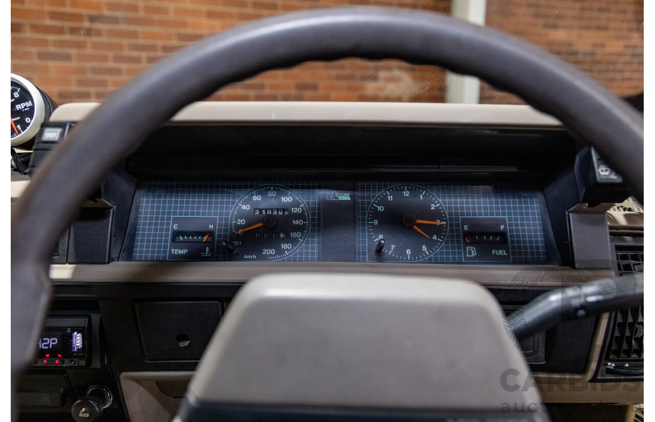 6/1987 Holden Commodore VL Turbo SL BT1 4d Sedan White Turbo 3.0L - Ex-Police - Modified