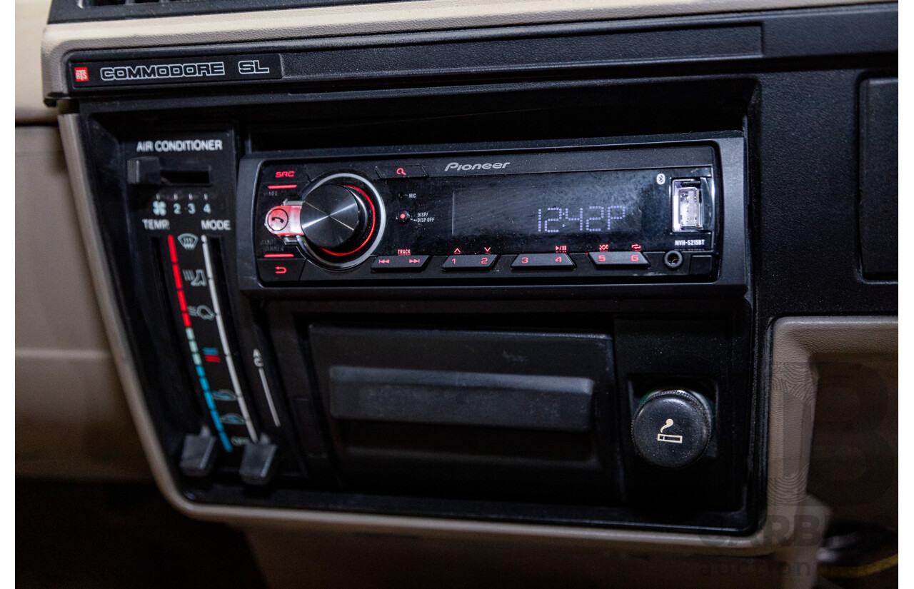 6/1987 Holden Commodore VL Turbo SL BT1 4d Sedan White Turbo 3.0L - Ex-Police - Modified