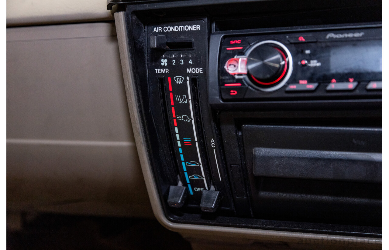 6/1987 Holden Commodore VL Turbo SL BT1 4d Sedan White Turbo 3.0L - Ex-Police - Modified