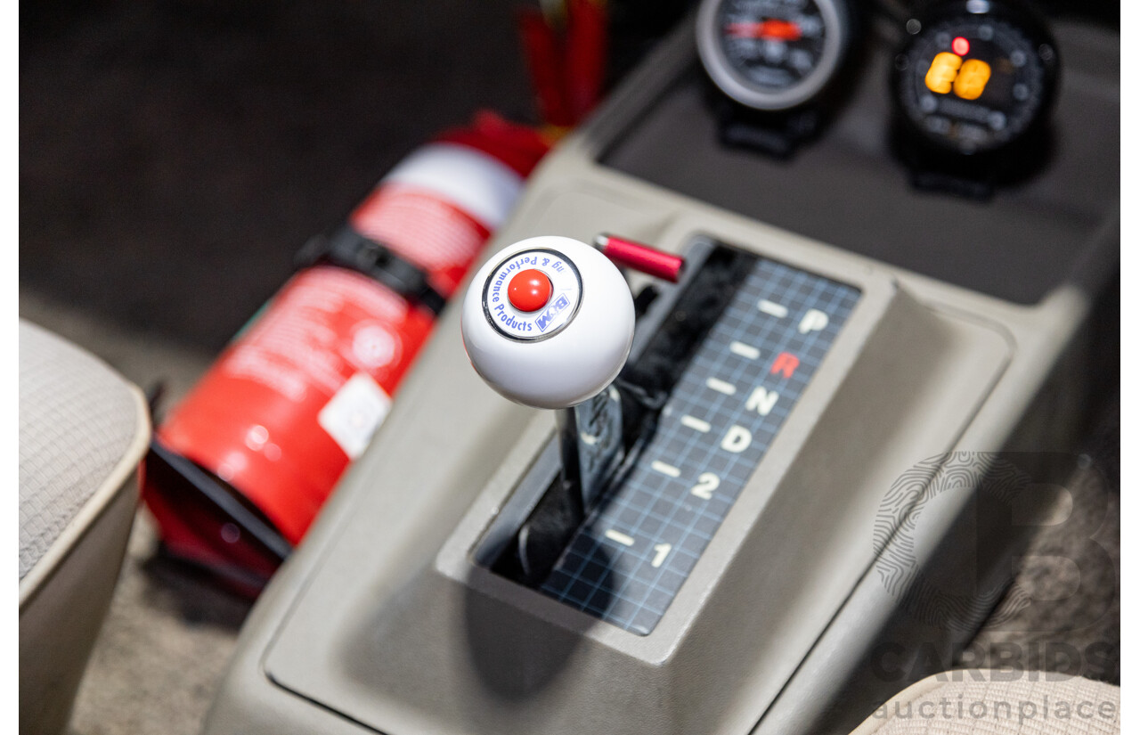 6/1987 Holden Commodore VL Turbo SL BT1 4d Sedan White Turbo 3.0L - Ex-Police - Modified
