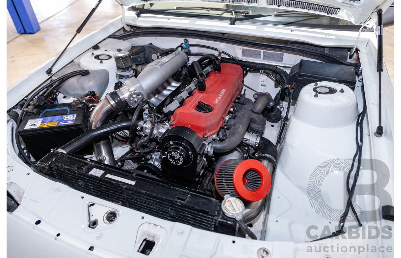 6/1987 Holden Commodore VL Turbo SL BT1 4d Sedan White Turbo 3.0L - Ex-Police - Modified