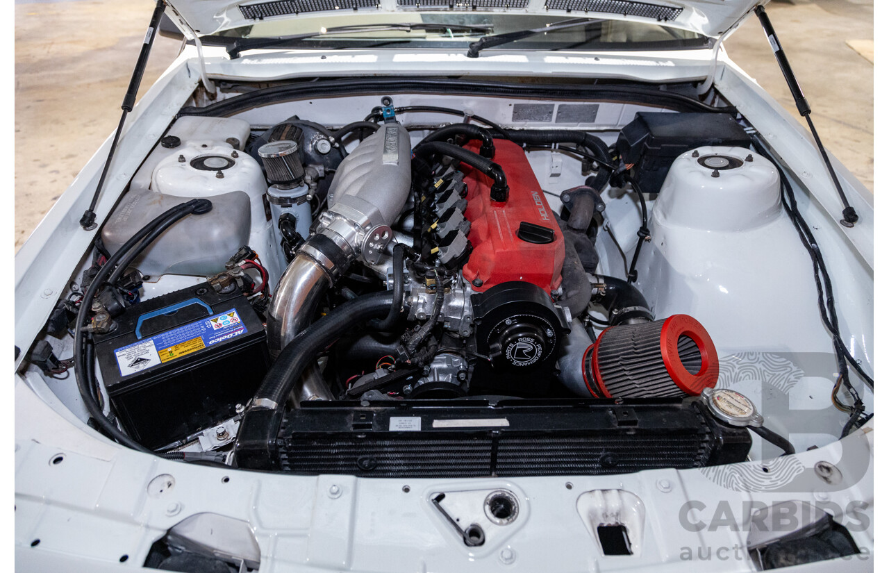 6/1987 Holden Commodore VL Turbo SL BT1 4d Sedan White Turbo 3.0L - Ex-Police - Modified
