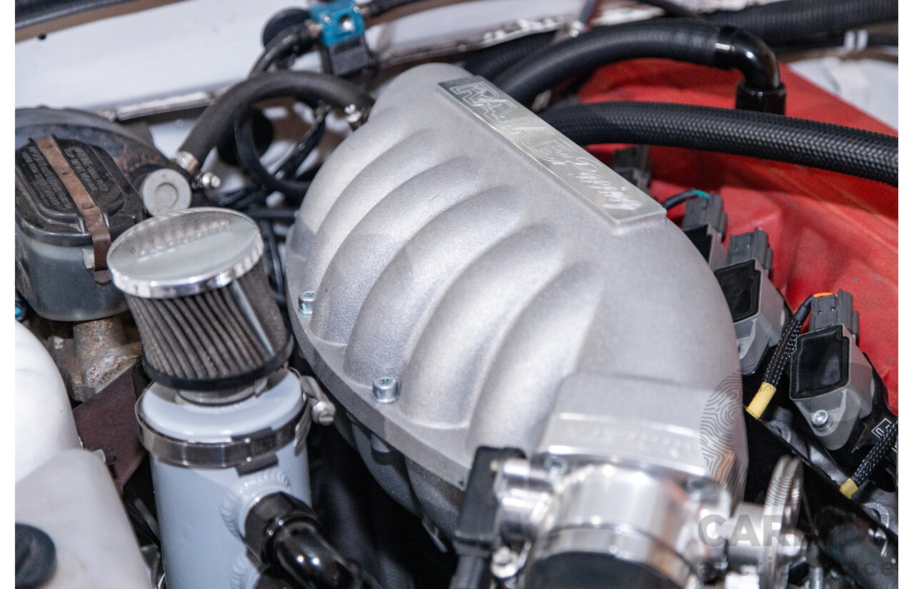 6/1987 Holden Commodore VL Turbo SL BT1 4d Sedan White Turbo 3.0L - Ex-Police - Modified