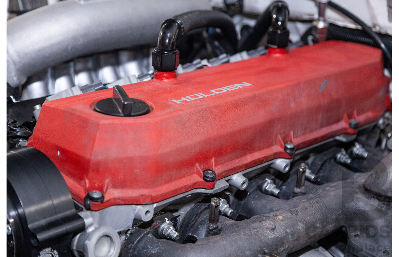 6/1987 Holden Commodore VL Turbo SL BT1 4d Sedan White Turbo 3.0L - Ex-Police - Modified