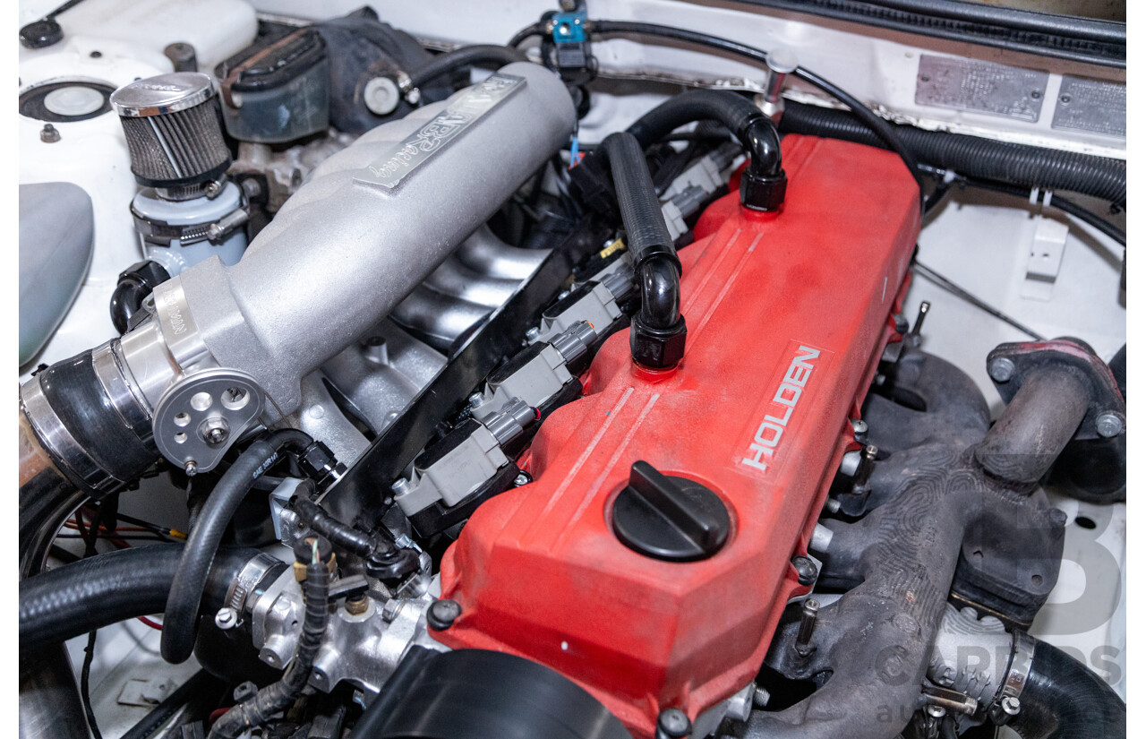 6/1987 Holden Commodore VL Turbo SL BT1 4d Sedan White Turbo 3.0L - Ex-Police - Modified