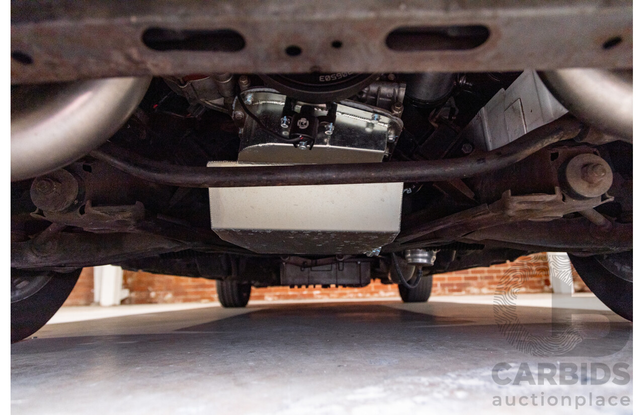 6/1987 Holden Commodore VL Turbo SL BT1 4d Sedan White Turbo 3.0L - Ex-Police - Modified