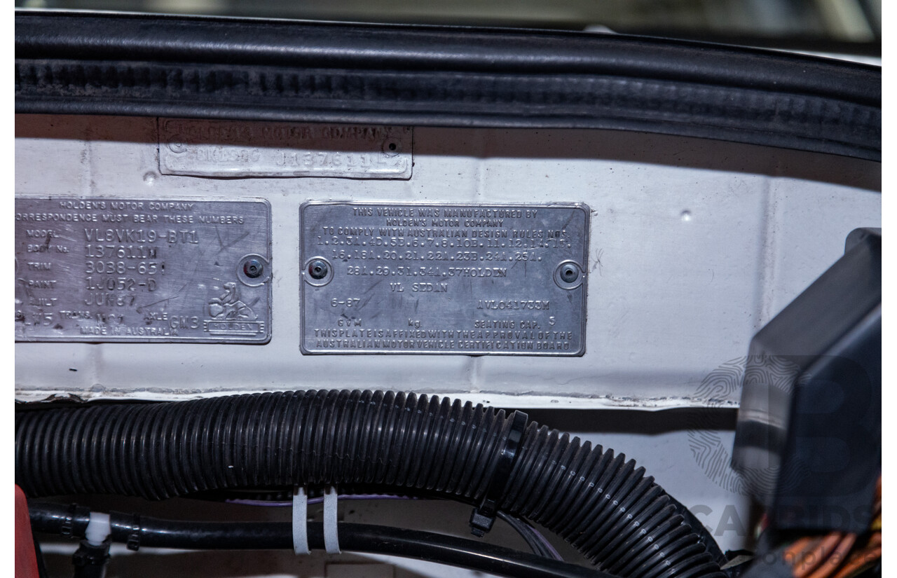 6/1987 Holden Commodore VL Turbo SL BT1 4d Sedan White Turbo 3.0L - Ex-Police - Modified