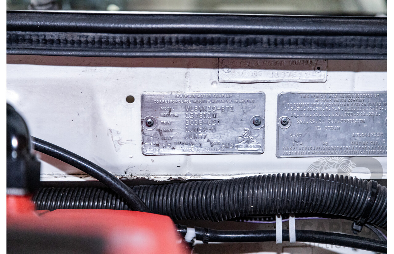 6/1987 Holden Commodore VL Turbo SL BT1 4d Sedan White Turbo 3.0L - Ex-Police - Modified