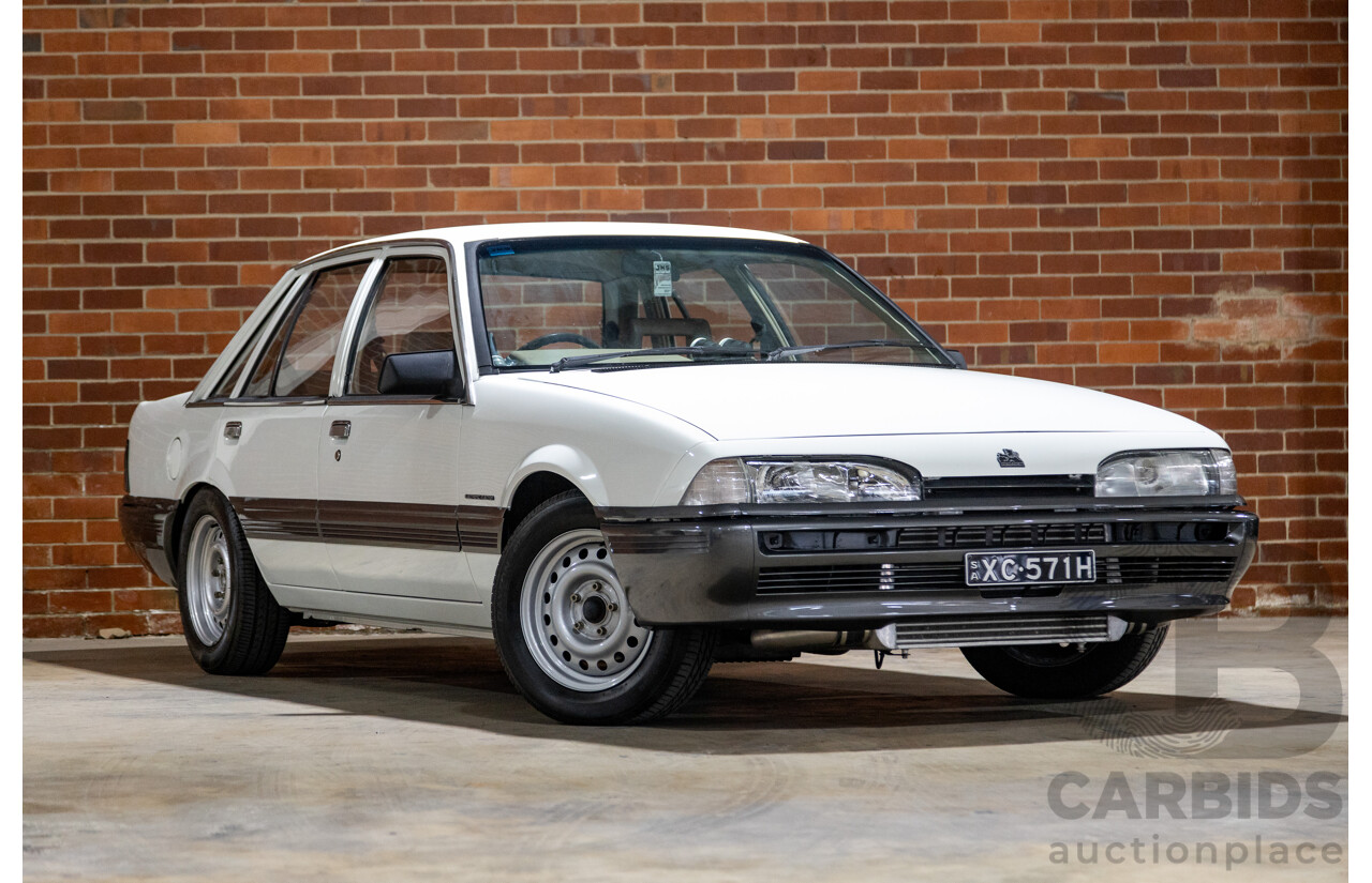 6/1987 Holden Commodore VL Turbo SL BT1 4d Sedan White Turbo 3.0L - Ex-Police - Modified