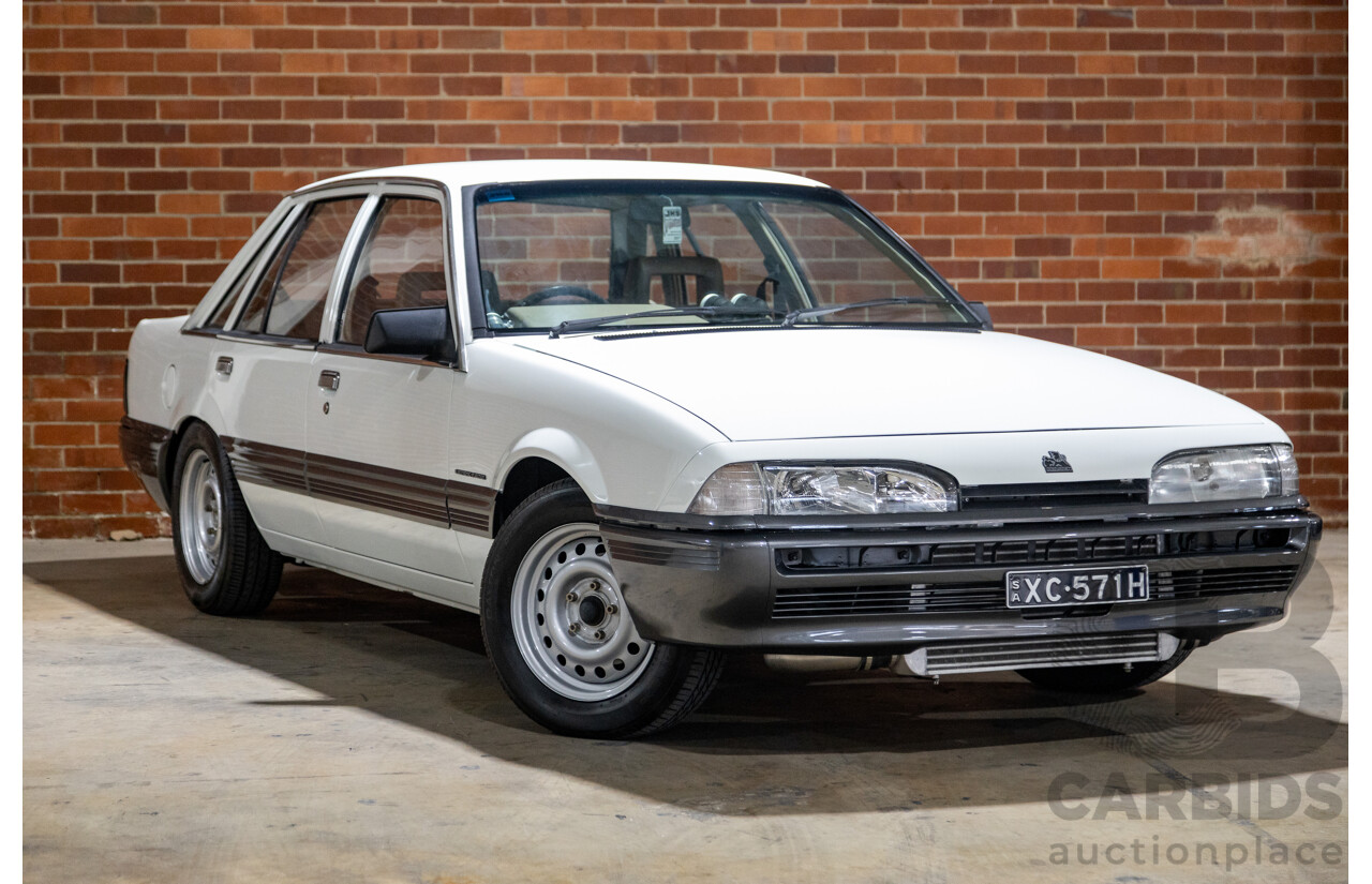 6/1987 Holden Commodore VL Turbo SL BT1 4d Sedan White Turbo 3.0L - Ex-Police - Modified