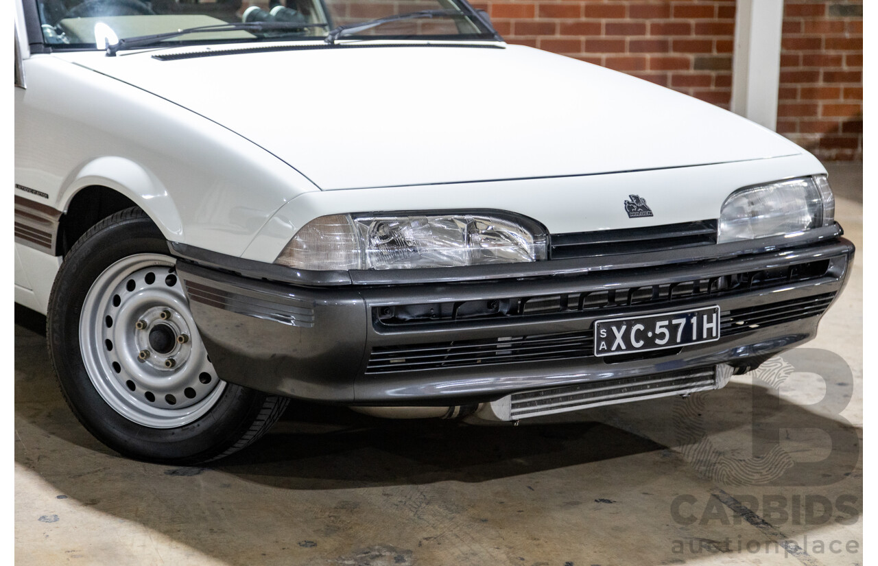 6/1987 Holden Commodore VL Turbo SL BT1 4d Sedan White Turbo 3.0L - Ex-Police - Modified