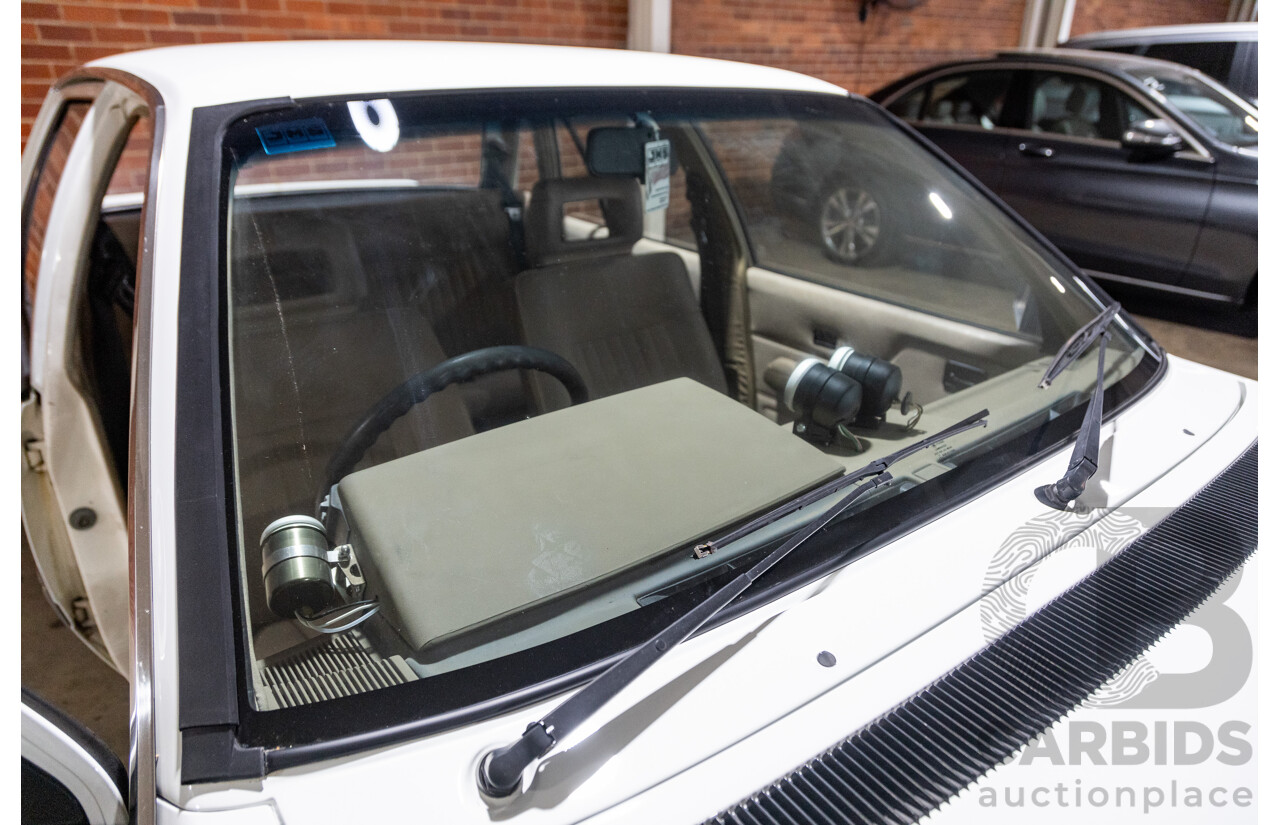 6/1987 Holden Commodore VL Turbo SL BT1 4d Sedan White Turbo 3.0L - Ex-Police - Modified