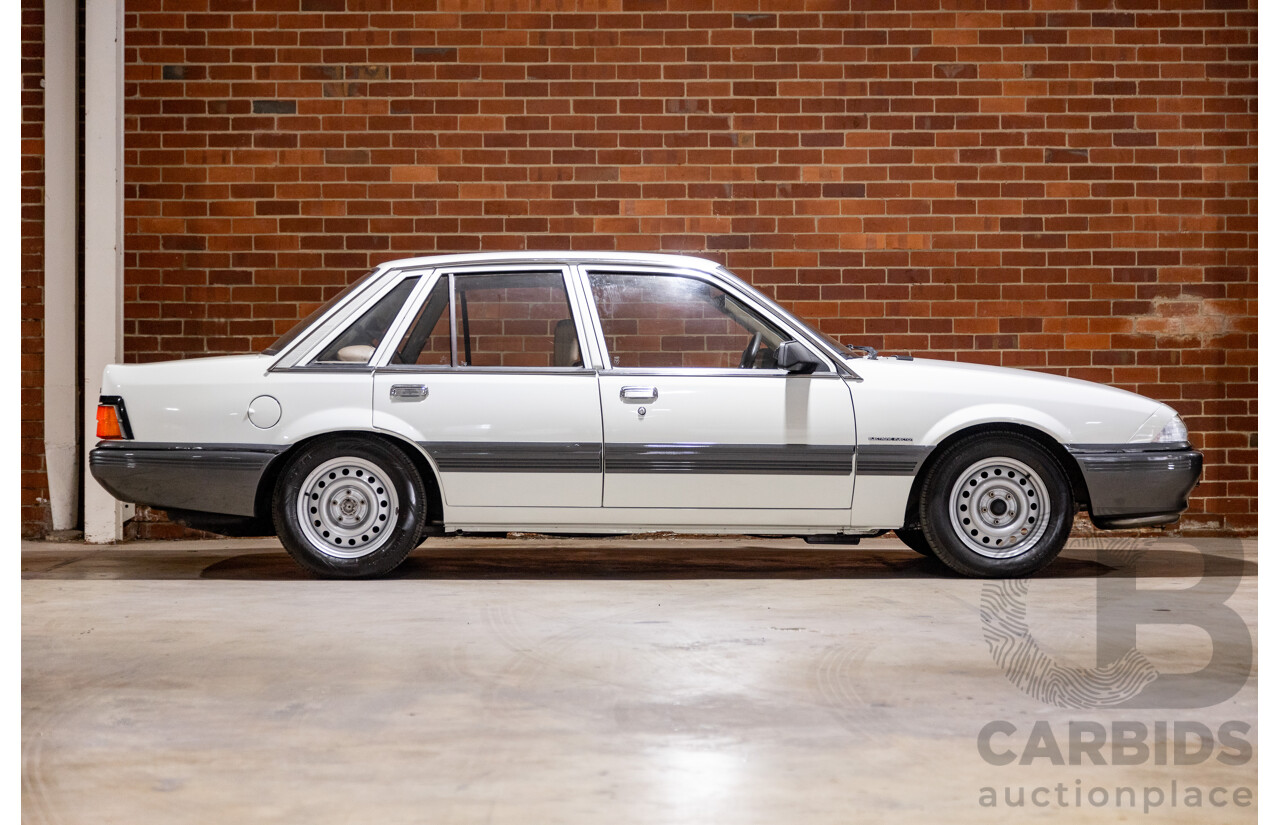6/1987 Holden Commodore VL Turbo SL BT1 4d Sedan White Turbo 3.0L - Ex-Police - Modified