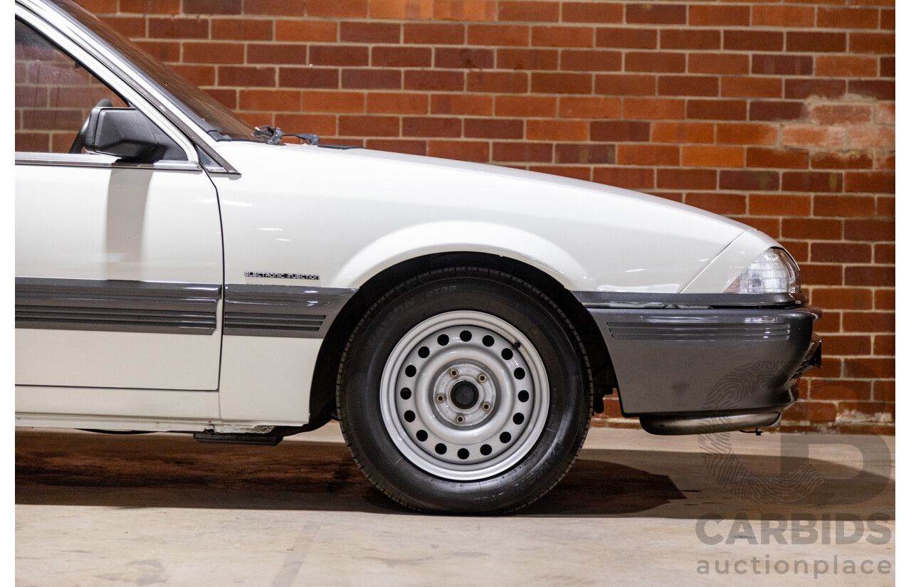 6/1987 Holden Commodore VL Turbo SL BT1 4d Sedan White Turbo 3.0L - Ex-Police - Modified